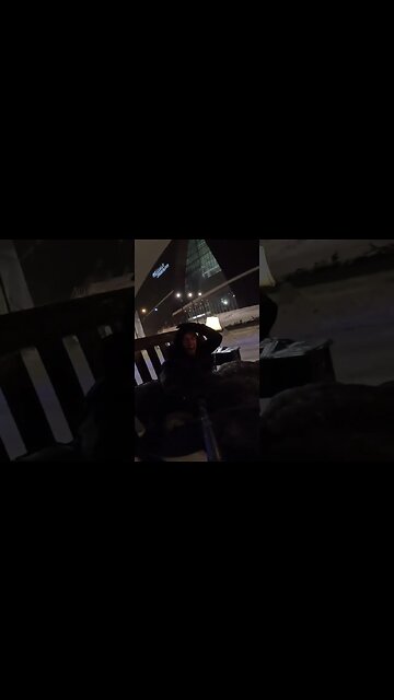 Man is pulled through downtown Minneapolis on a "bed-sled."