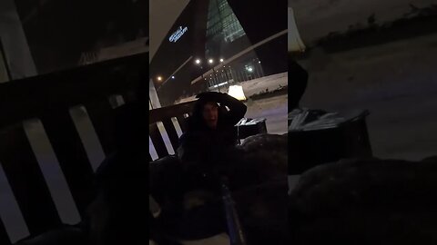 Man is pulled through downtown Minneapolis on a "bed-sled."