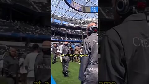 What are all of these robots doing at the sports game? #Shorts #Trending. Chargers game￼