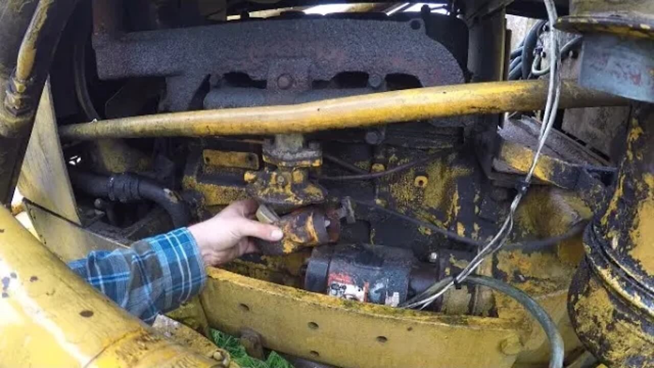 Cleaning the carb on the John Deere backhoe