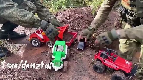 Russian soldiers playing with toys on the battlefield