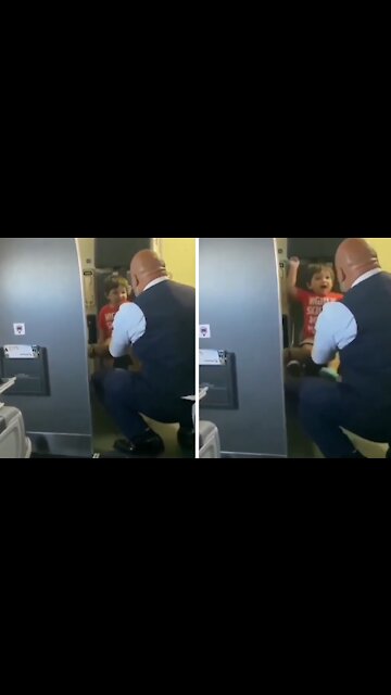 Compassionate flight attendant plays with little kid before takeoff