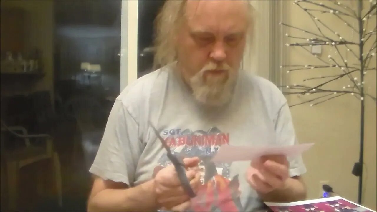 Mormo Cuts A Sheet Of Artist Trading Card Prints