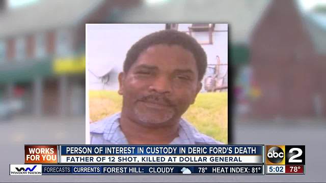 Person of interest in custody in murder at Dollar General store