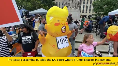 Protesters assemble outside the DC court where Trump is facing indictment.