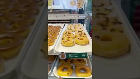 Bees cover donuts at a Krispy Kreme doughnuts in Mexico