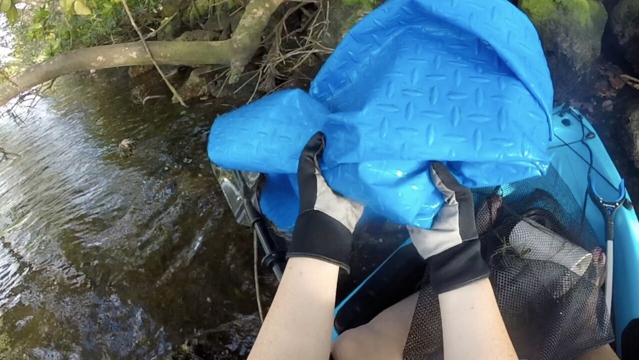 Removing a Huge Tarp from the New River in Fort Lauderdale Florida