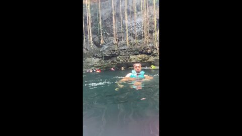 Swimming in a cave with fish