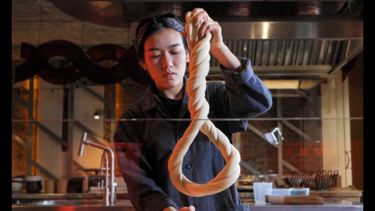 One beautiful girl feeds noodles to 100 people