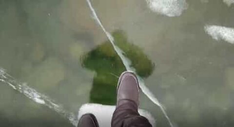 This guy takes a big risk to film a frozen lake