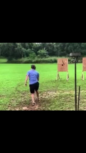 Safety first... Zuckerberg covers ears while chucking spears