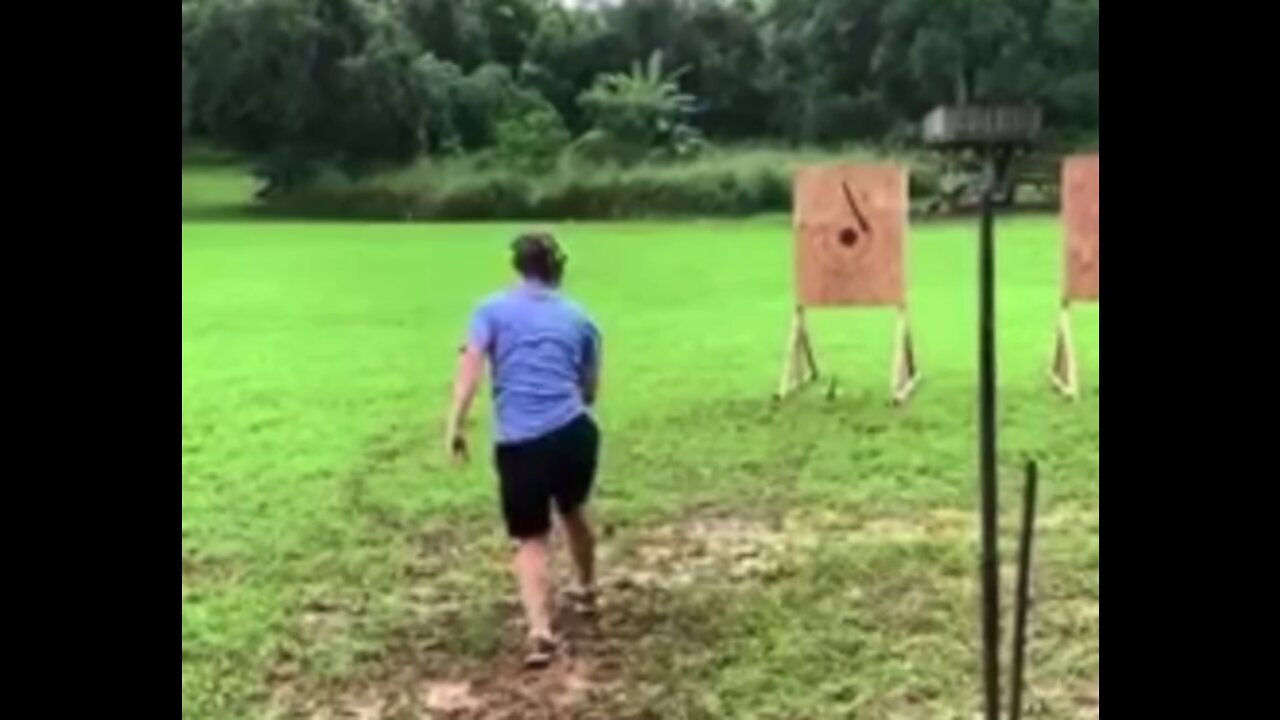 Safety first... Zuckerberg covers ears while chucking spears