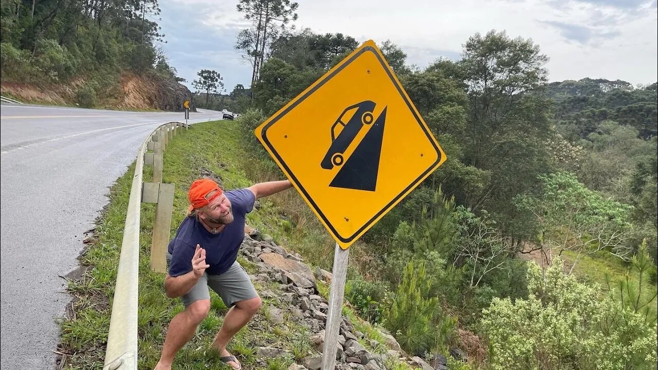 Three world travelers going on a road trip through Brazil reaching a sound off with loud music.