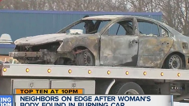 Woman's body found in burned out car