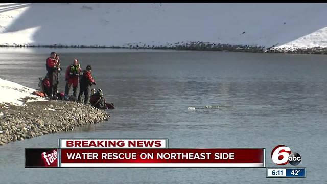 Father, child rescued from vehicle after it plunges into pond on Indy's north side