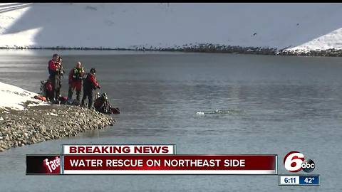 Father, child rescued from vehicle after it plunges into pond on Indy's north side
