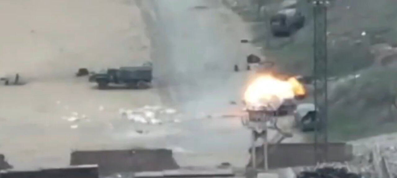Ukrainian troops destroy a Russian military vehicle on the coast of Mariupol