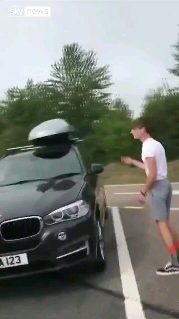 British family returning from holiday find 2 immigrants inside their car roof.