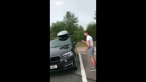 British family returning from holiday find 2 immigrants inside their car roof.