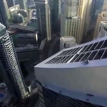 Fearless Daredevil Slides Down Extremely Tall Skyscraper