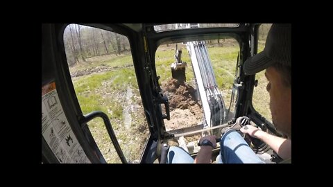 Draining flooded food plot with Bobcat mini excavator