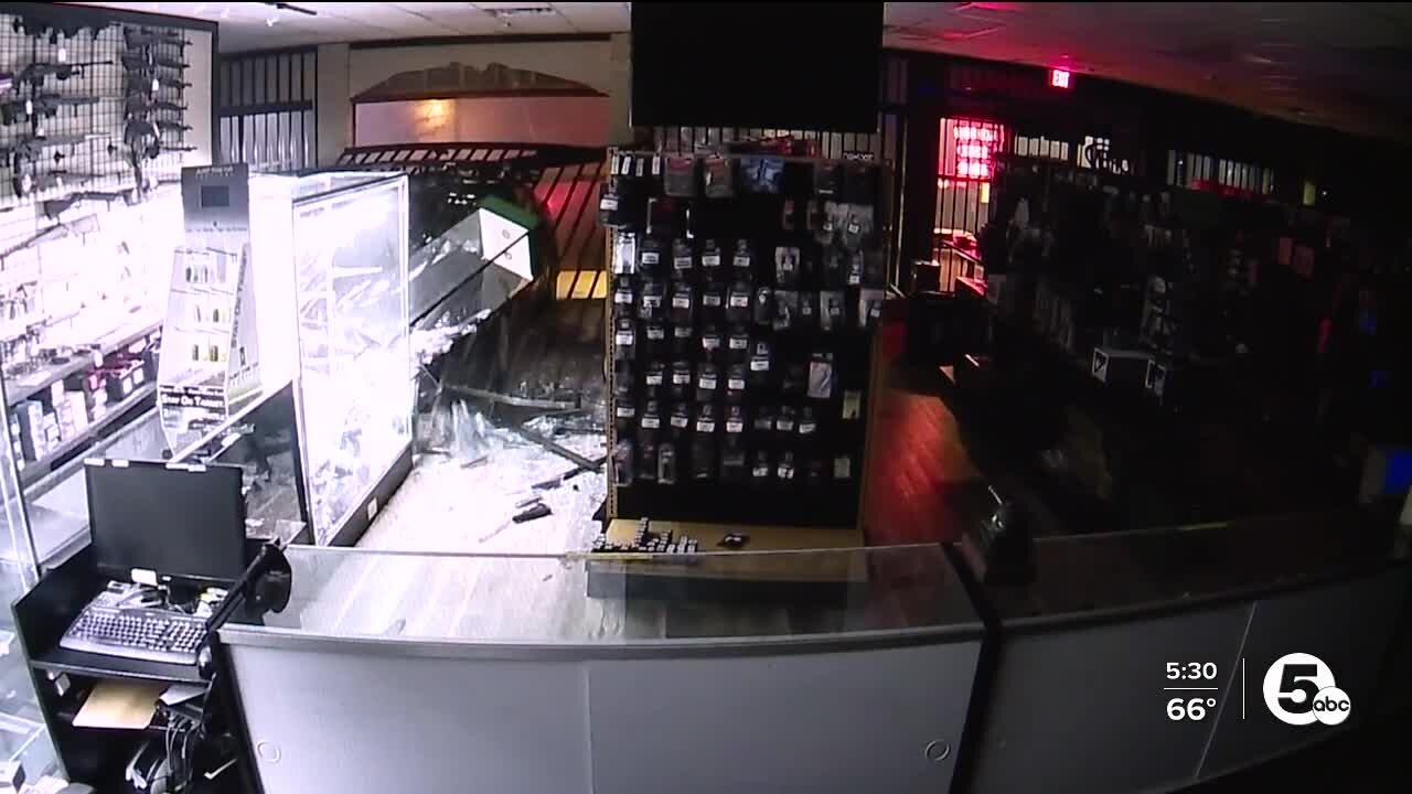 Guns stolen after car crashes into gun store