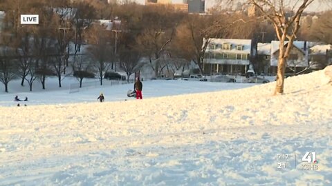 Some people take to the hills for sledding during Thursday's snow day