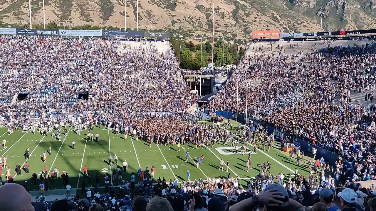 Football fans rush the field...