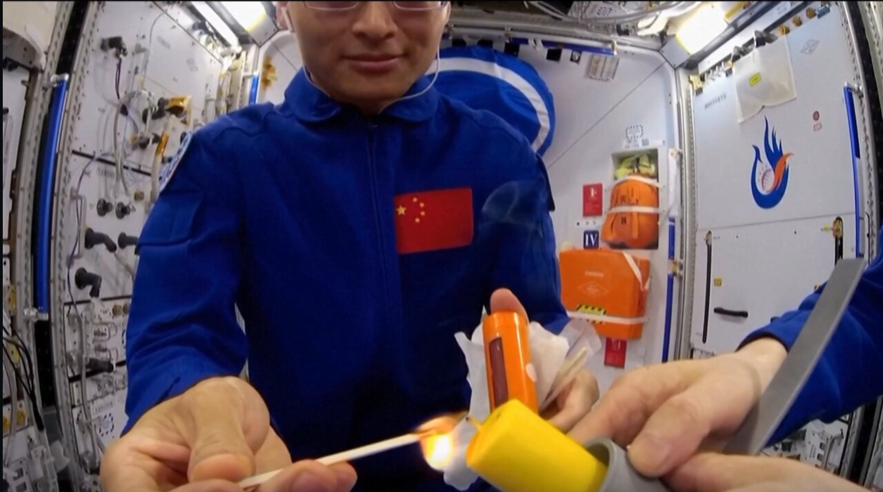 Watch Chinese astronauts light a match on Tiangong space station (video)