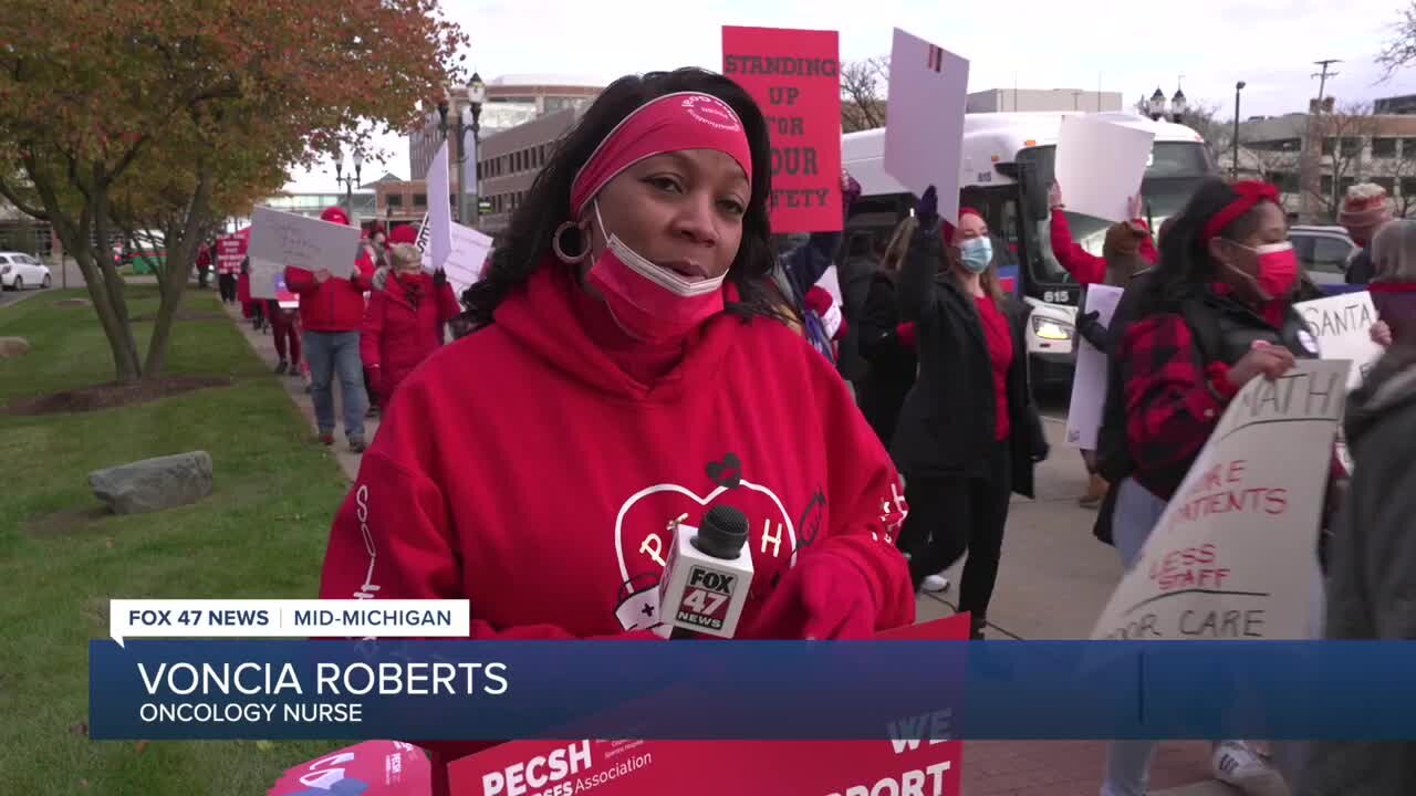 Hundreds of medical professionals picket outside of Sparrow Hospital