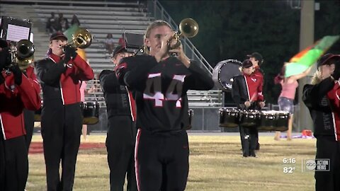 Bloomingdale's David Owen swaps helmet for trumpet at halftime