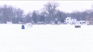 Father and son hit the ice and take advantage of free fishing weekend in Wisconsin