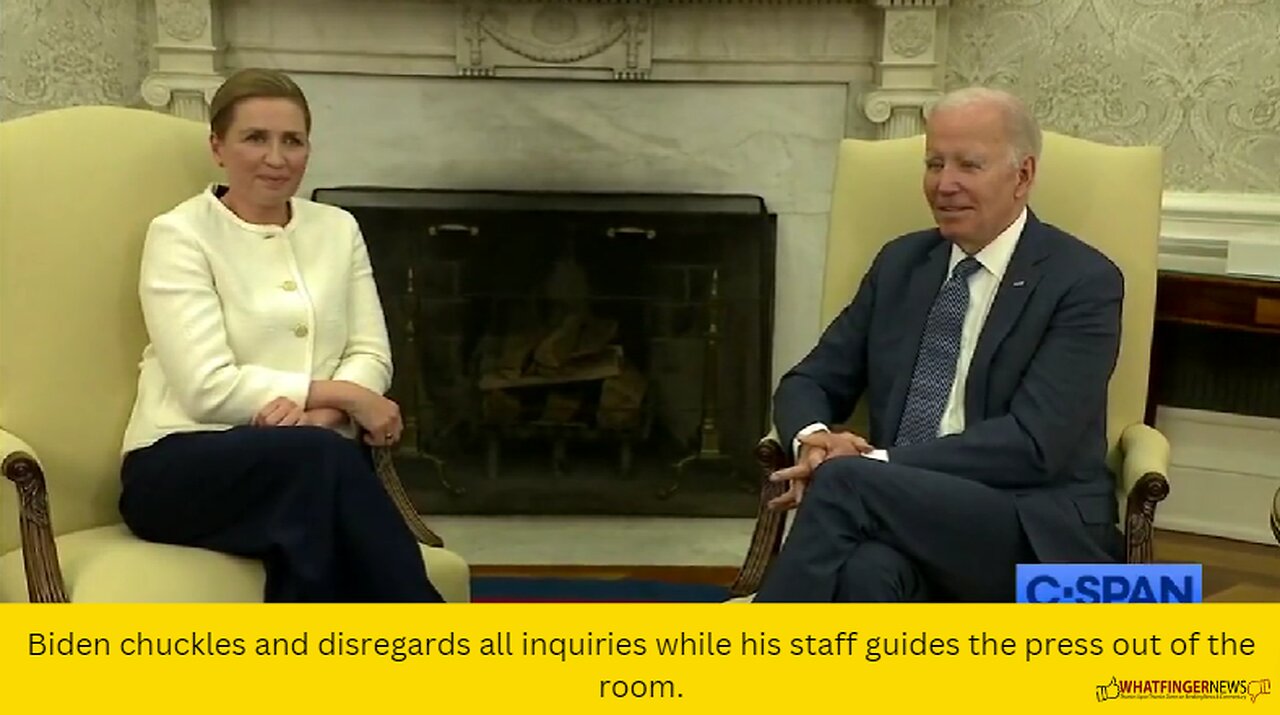 Biden chuckles and disregards all inquiries while his staff guides the press out of the room.