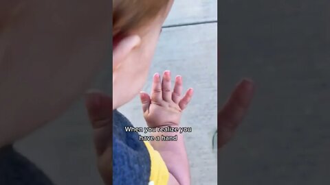 Baby girl discovers her own hand || #shorts
