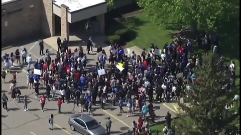 Dozens protest over principal's abrupt suspension