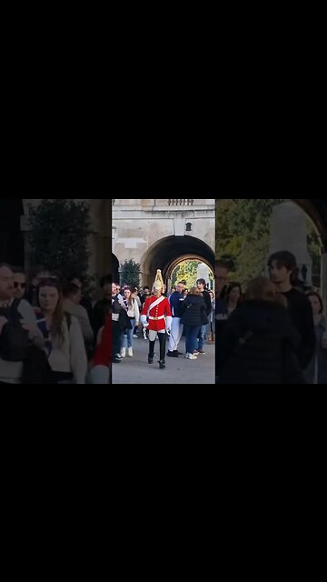 Guard pushes past tourist the look on his face #horseguardsparade