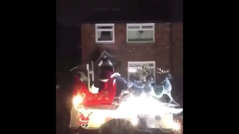 Santa Comes Rolling Through A British Street At Night