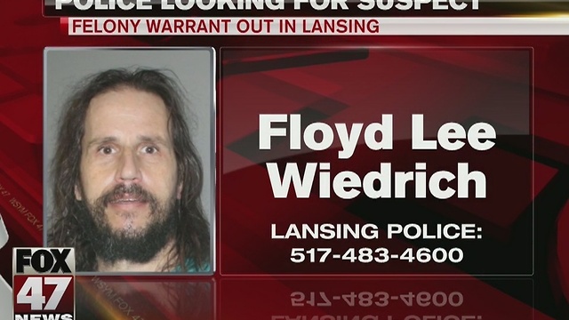 Police search for suspect with felony warrant out in Lansing