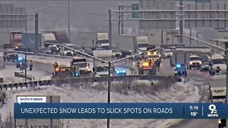 Unexpected snow leads to slick spots, traffic problems