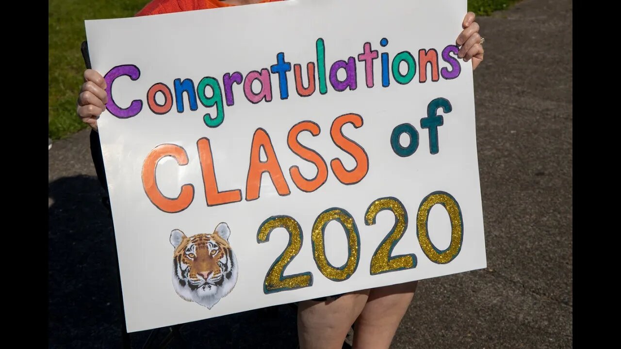 Battle Ground High School seniors do drive-thru cap and gown pickup