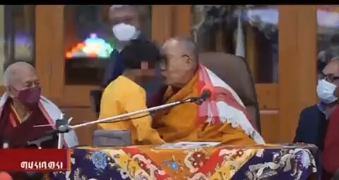 These people are sick. Dalai Lama demands a child suck his tongue in public!