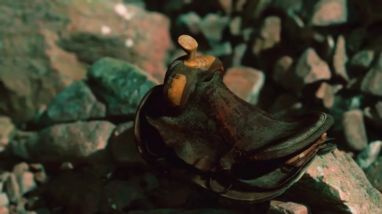 Old leather saddle on the stone outdoor