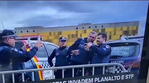 Police taking selfies while people breach their capital