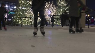 People enjoy the snowy weather at Titletown