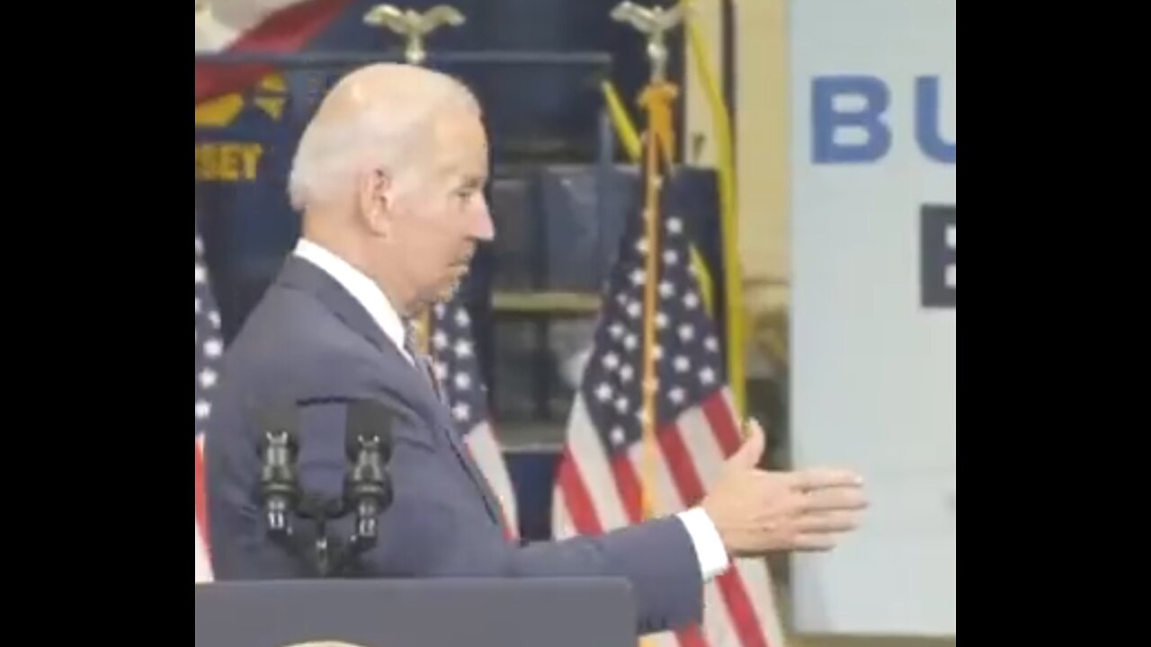 Biden shaking hands with invisible guys