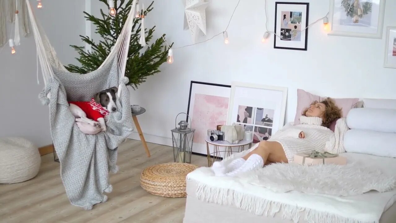 Interior design solutions for winter celebrations Sleepy woman and pet chilling in white bedroom wi