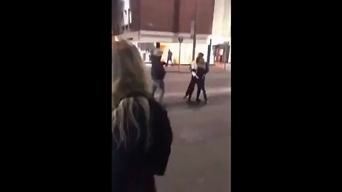 Woman gets punched after getting in-between two men.