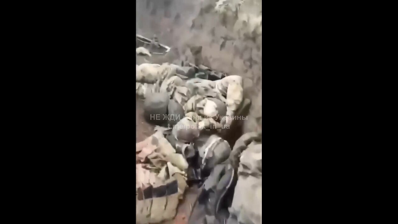 A Russian occupier literally walks over the bodies of his own comrades