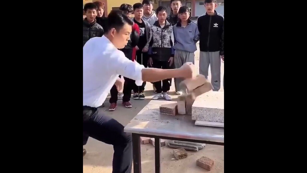 Martial Arts Dude Blows Everyone's Mind With The Bruce Lee Brick Split Trick