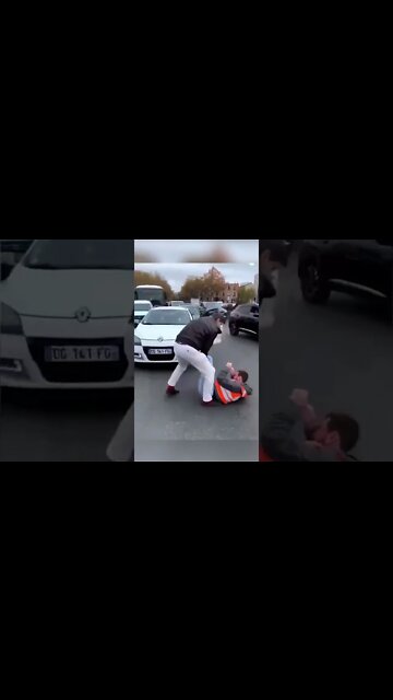 Large angry French man physically removes climate activists from the street
